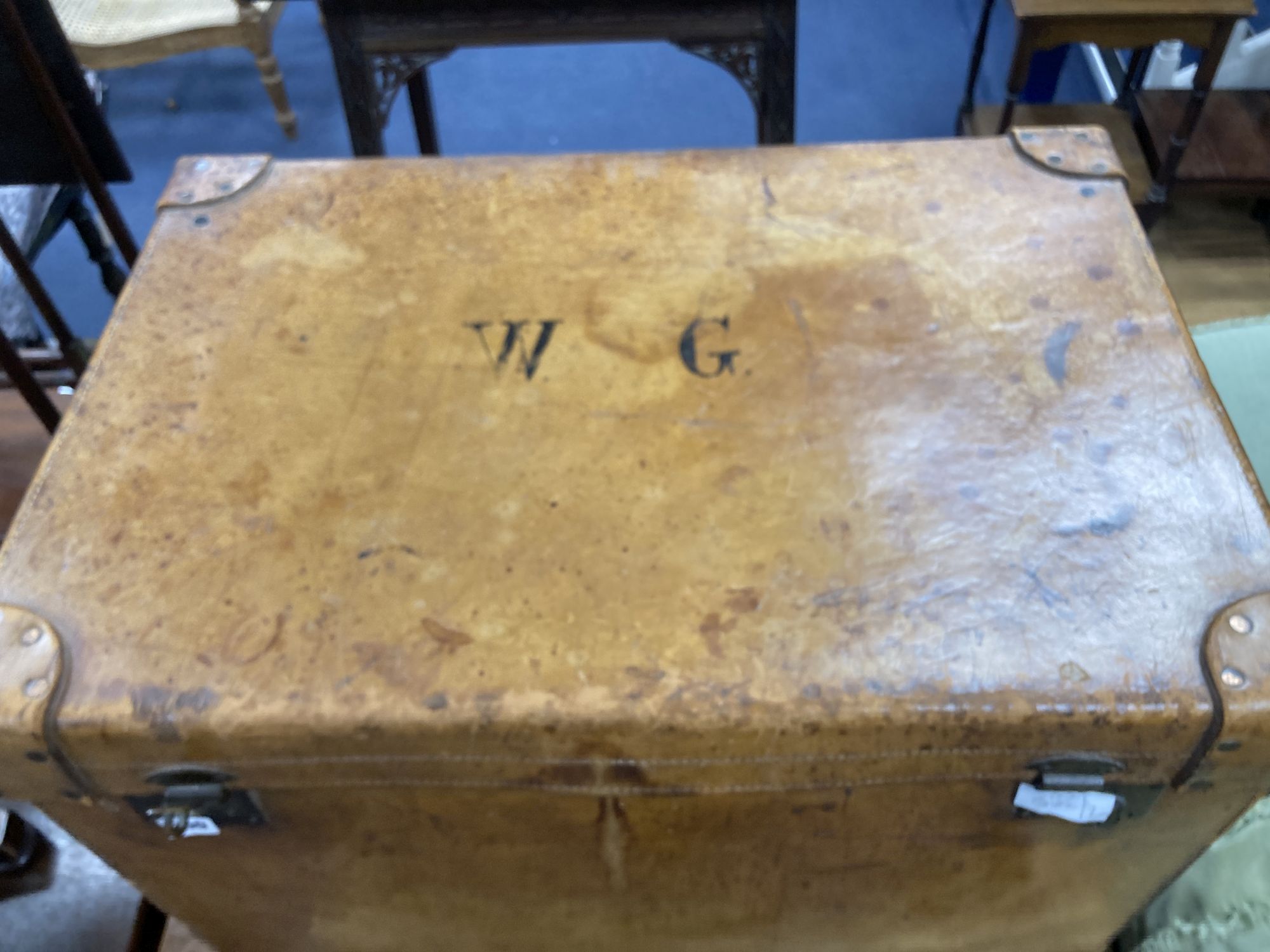 A large Victorian tan leather travelling trunk, width 76cm, depth 52cm, height 58cm together with a rectangular gilt gesso picture fram